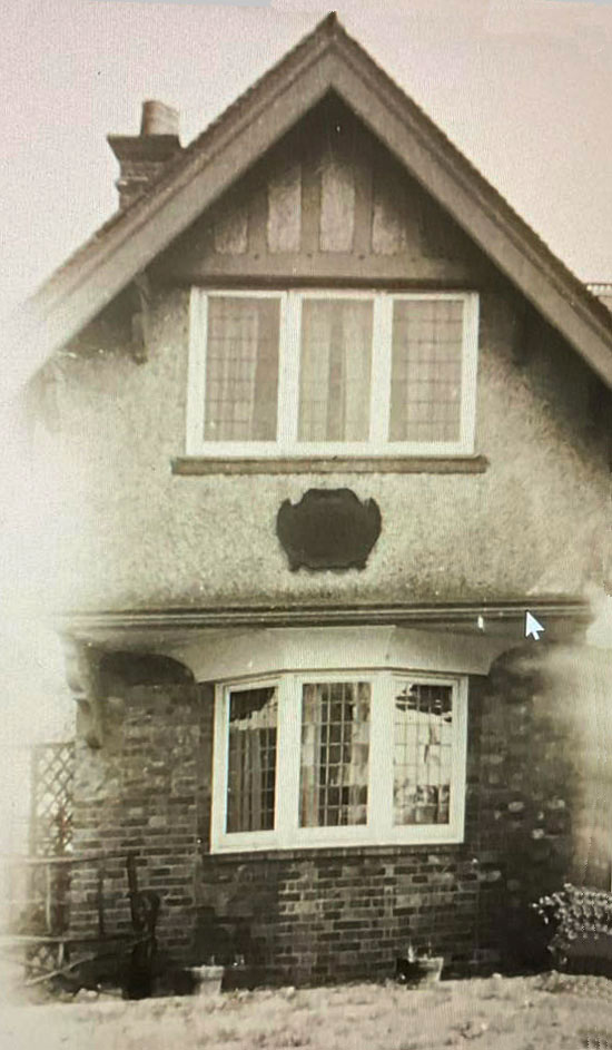 War Memorial Cottage with plaque